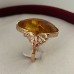 Golden ring with amber stone