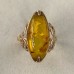 Golden ring with amber stone